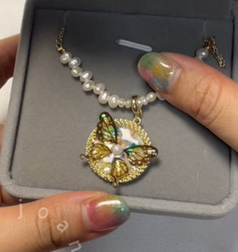 Butterfly Pearl Necklace with 18K Gold-Plated Resin Pendant and Freshwater Pearls.