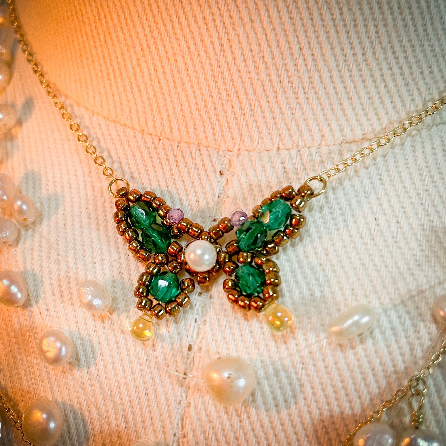 Elegant handmade necklace featuring a Morpho Anaxibia-inspired design in blue tones