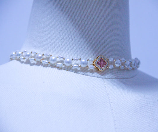 Close-up of Victorian-inspired pearl choker with elegant zircon accents