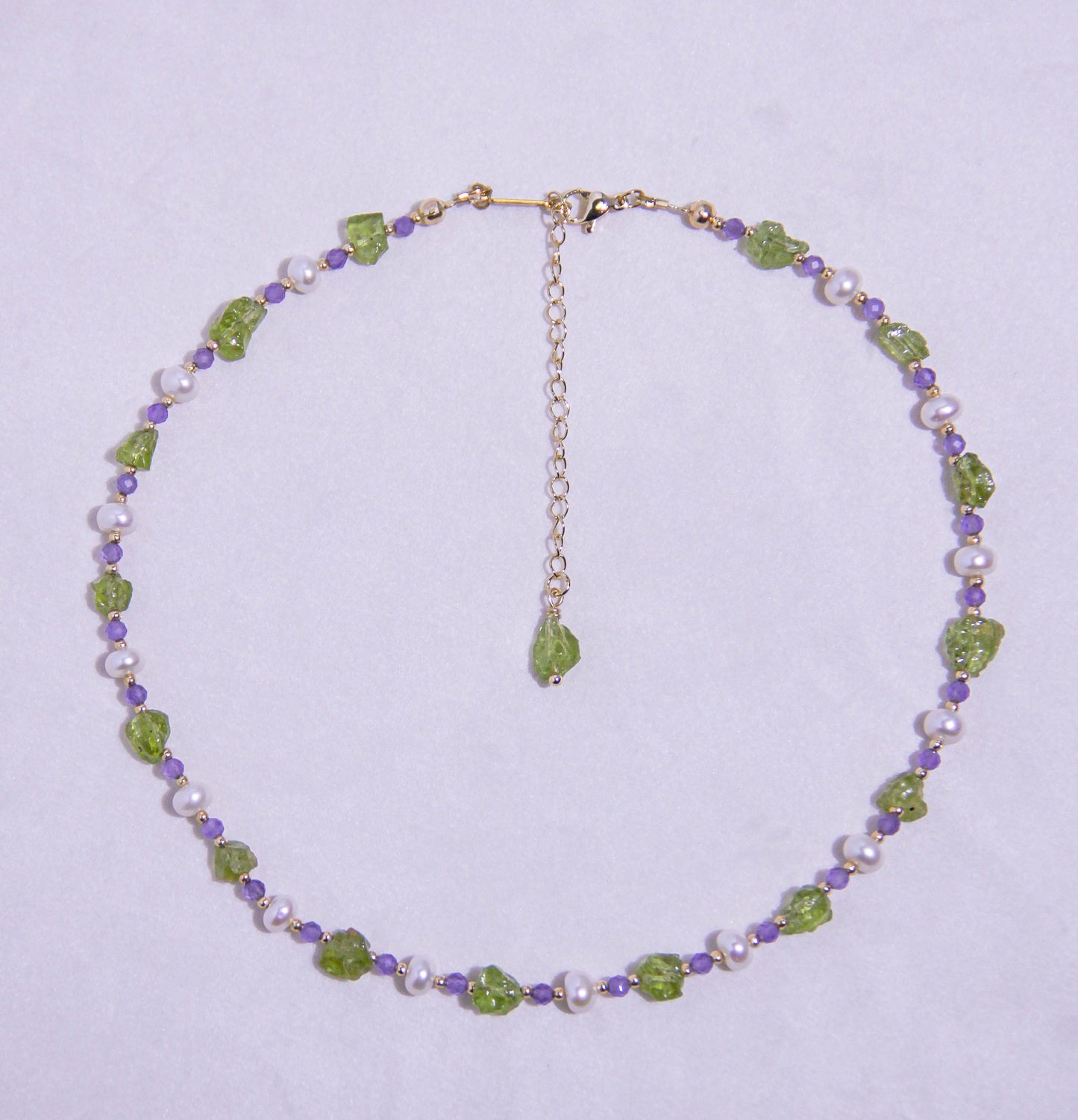 legant Peridot and Amethyst crystal necklace styled for August birthdays and meditation practices