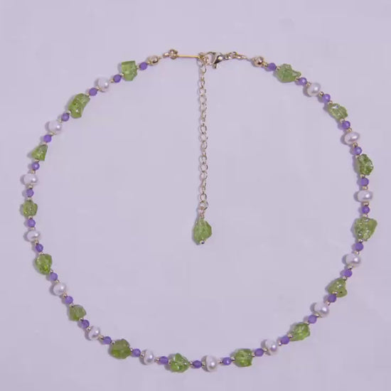 Handmade Peridot Amethyst Pearl necklace with 18K gold-plated adjustable chain, displayed in a circular design