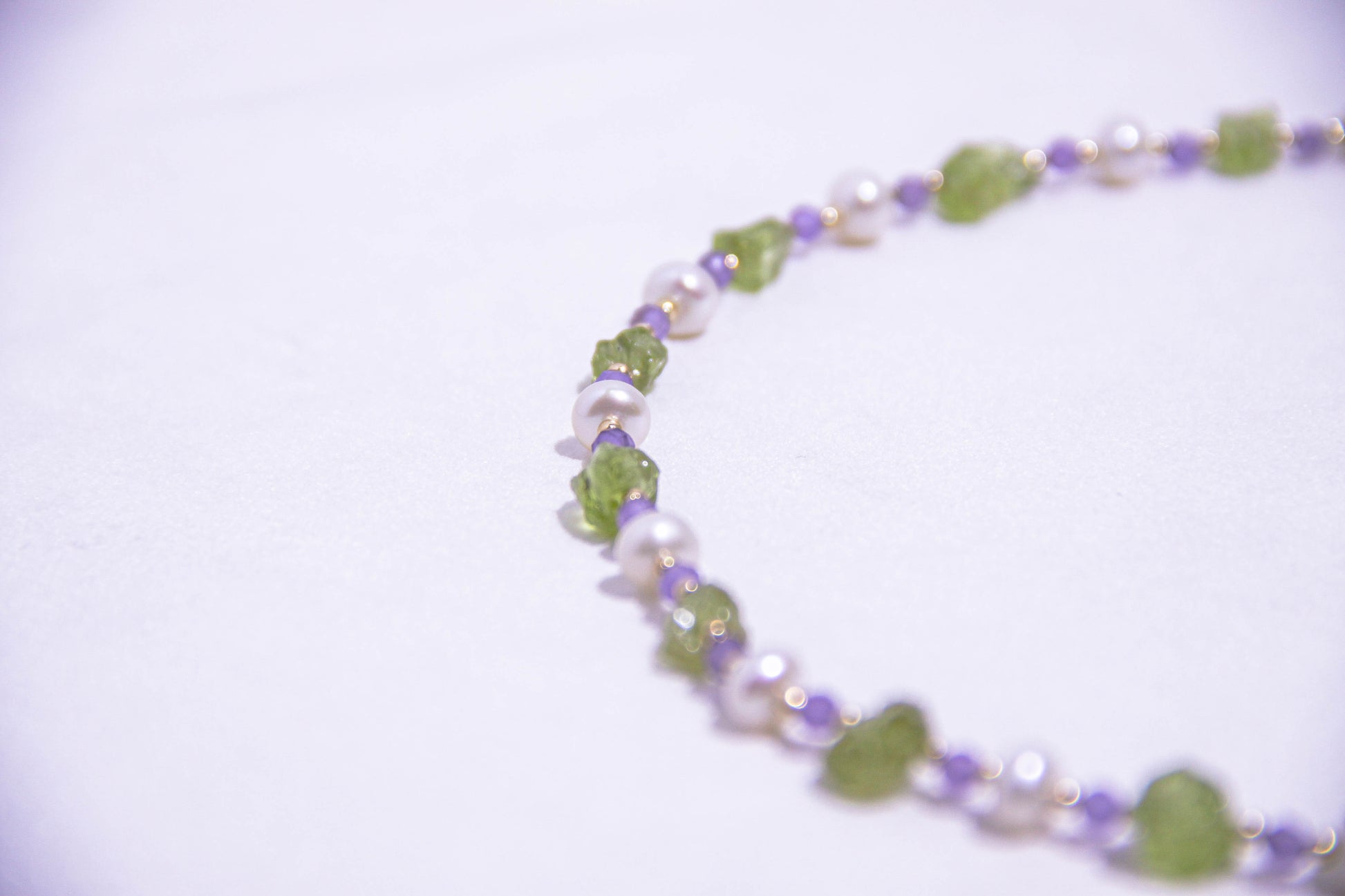 Gift-ready Peridot and Amethyst necklace in eco-friendly packaging, perfect for special occasions